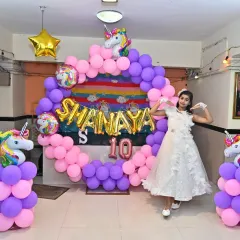 A happy birthday girl posing with her Unicorn theme party decoration. We love it when our clients appreciate and share photos of our work.