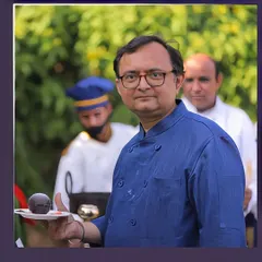 Our head chef presenting one of his signature dessert creations. He personally oversees the menu development and execution for our most exclusive events.