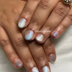 Another gorgeous look for short nails. This one uses a holographic, pearlescent polish that shifts in the light, creating a magical effect.