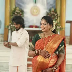 A beautiful moment from a baby shower ceremony in a church. Her makeup is kept soft and luminous, complementing the serene and joyful atmosphere.