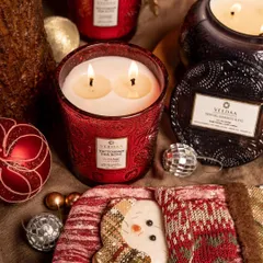 Christmas is a feeling. Our Victorian Tea Rose candle in a festive red jar, surrounded by holiday decor, captures the warmth and joy of the season.
