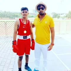 Posing with Jaideep Singh after he won the Interzone School Boxing Championship in 2022. We start training champions from a young age, building a strong foundation for their future in boxing.