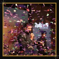The energy of a live performance is unmatched. This shot captures a singer on stage during a New Year's Eve party we organized, with confetti raining down, creating a high-energy, celebratory moment.