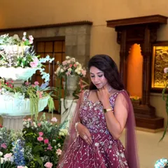 A moment of quiet elegance. This wine-colored ball gown features delicate, branch-like embroidery, making it a unique and romantic choice for an engagement or reception.