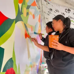 Working alongside students at St. Claret College in Ziro. Their energy and support were a huge part of making the 100-foot mural project a success.