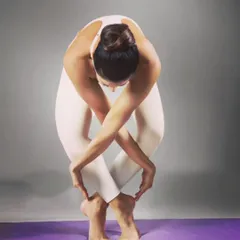 The desire for symmetry, for balance, for rhythm in form. This creative standing forward bend with crossed arms and legs is a beautiful exploration of lines and shapes.