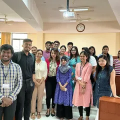 A group photo with students after a session on body language. It's amazing to see their confidence grow as they learn how to use posture and non verbal cues to their advantage.