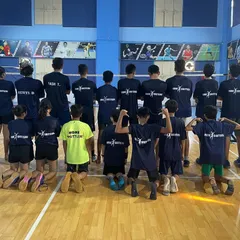 A look at our team from behind, united in their Home Shuttlers gear. This photo captures the sense of belonging and shared purpose we cultivate throughout the camp.