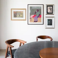 A detail of the custom dining table I designed for this art-filled home. The top is a durable, textured terrazzo, complemented by a solid wood lazy susan for shared meals.