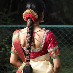 Another beautiful example of a South Indian bridal hairstyle. The combination of the braid, flowers, and hair jewelry is a key part of the complete bridal look.
