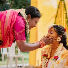 A mother's gentle touch during the Haldi ceremony. I focus on these small, meaningful interactions that represent a lifetime of love and blessings.