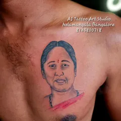 A memorial portrait of a mother, placed over the heart. I take great care to capture the warmth and personality in these tribute tattoos.