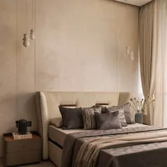 I believe a neutral palette is the perfect canvas for tranquility. In this master bedroom, I layered various shades of beige and grey with different textures, from the plush headboard to the soft linens, creating a space that feels both sophisticated and incredibly restful.