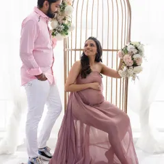 A sweet and romantic couple's maternity shot. The soft, natural makeup ensures the focus remains on the beautiful connection and the joy of the moment.