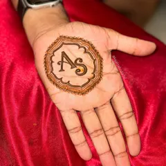 A clean, crisp shot of the 'AS' initial design for the groom, showing the bold lines and shading.