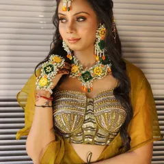 A close-up of the mehendi look, highlighting the unique bustier and the beautiful floral jewelry that completes the ensemble.