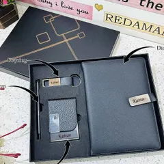 This corporate-style gift set is perfect for professionals. It features a personalized lock diary, a cardholder, a metal pen, and a metal hook keychain, all presented in a premium black box.