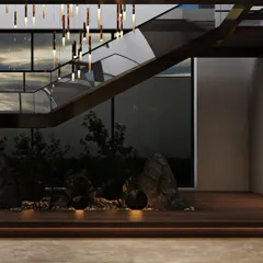 Another view of the under-staircase garden shows how it is framed by the home's architecture. The large glass wall behind it connects this indoor green space with the outdoor landscape, creating a multi-layered view of nature.