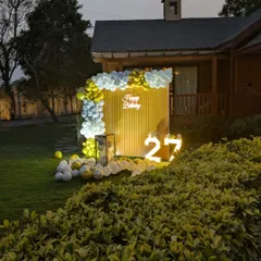 A long shot showing how the decoration setup becomes a focal point in the garden.