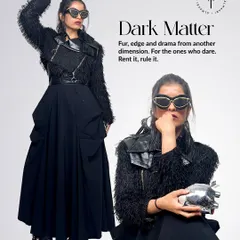 This look, 'Dark Matter', is all about fur, edge, and drama. I layered a shaggy black jacket over a black dress and cinched it with a wide belt. The silver heart clutch adds a touch of metallic contrast.