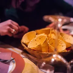 A basket of crispy papad cones, ready to be served. This is a modern and convenient way we present a classic Indian accompaniment, perfect for guests to enjoy while mingling.