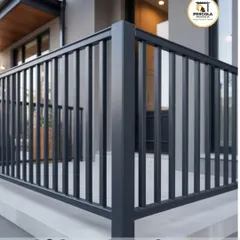 A close-up view of a corner section of a modern black balcony railing. The image highlights the clean joints and durable powder-coated finish, showcasing the quality and precision of our fabrication.