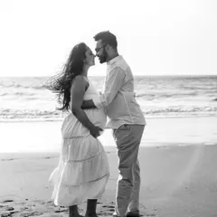 A romantic and windswept moment on the beach, captured in beautiful black and white. This edit gives the photo a timeless, classic feel, focusing entirely on the couple's connection.