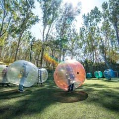 This is what pure, unadulterated fun looks like. Get your team bouncing, bumping, and rolling with a game of Bubble Soccer.