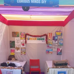 My stall is ready for the artists. I display examples of the crafts to inspire the kids and have all the materials neatly arranged for a busy day of fun.