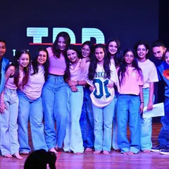 This is what we mean by family. A candid moment with our extraordinary humans on stage after a performance. We rehearse together, grow together, and celebrate together. This is our tribe.
