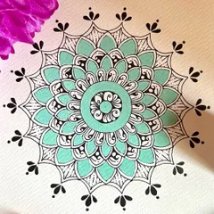 This pastel mandala in a soothing mint green is one of my favorites. The combination of the soft color with the intricate black patterns creates a beautiful balance, perfect for adding a touch of tranquility to your space.