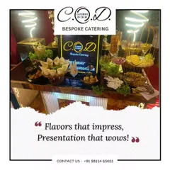 Flavors that impress, presentation that wows. This appetizer station features a variety of bite-sized snacks like cones and canapés, beautifully arranged on an illuminated counter with modern neon lighting.