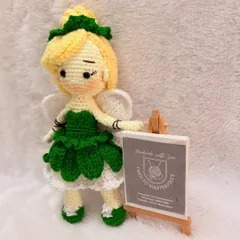 Bringing fairy tales to life, one stitch at a time. Here is my version of the beloved fairy Tinkerbell, a 10-inch amigurumi doll complete with her signature green dress, wings, and hairstyle, crafted from soft cotton yarn.