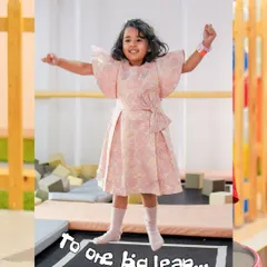 To one big leap. This little one is celebrating our first anniversary by enjoying the trampoline, a perfect spot for joyful, energetic play.