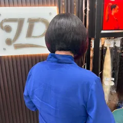 A back view of a chic bob haircut, showing the precise shape and graduation.