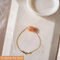 My 'haati' elephant bracelet in peach moonstone. This charm is for new beginnings, inner growth, and strength. It's wonderful for soothing emotional instability and stress.