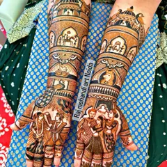 Your wedding story, told through henna. This design captures multiple ceremonies, including the varmala and family portraits on the palms, with a detailed doli scene on the forearms, making it a true narrative masterpiece.