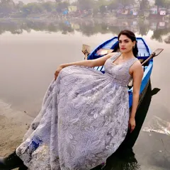 Another angle of the grey lace gown, showing its full volume and how it drapes elegantly, making it a stunning choice for an editorial or pre-wedding photoshoot.