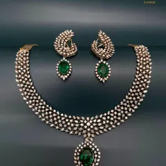 Wearing this exquisite Diamond and Emerald Set is like wrapping yourself in love and heritage. Shine bright at every celebration and let your story unfold with a piece that is both classic and contemporary.