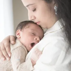 The purest moments are often the quietest. A sleepy yawn, a gentle kiss on the forehead, the feeling of a mother's embrace. These are the tiny miracles I live to capture during my newborn sessions.