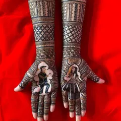 A stunning example of portrait mehandi for an engagement bride. The design features the couple in a romantic pose, surrounded by intricate patterns.