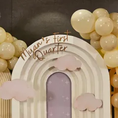 A close-up of the custom lettering on the rainbow backdrop, celebrating a 3-month milestone.