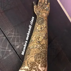 Look at the detail in this full-arm bridal design. We cover everything from floral motifs to delicate netting, or 'jaali' work, in my advanced lessons.