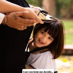 A playful peek-a-boo with the baby bump. Including older siblings in the photoshoot is a wonderful way to make them feel involved and excited about their new role.