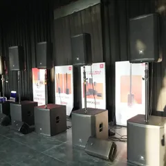 This lineup showcases a range of JBL Professional speakers and subwoofers at a product demonstration event. I help clients from bands to rental companies select the right combination of gear to achieve the perfect sound for their specific needs.