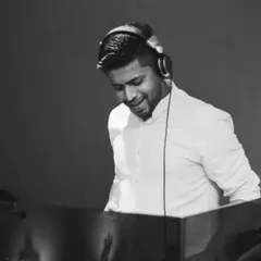 A simple, happy moment behind the decks. This black and white photo captures the genuine joy I feel when I'm playing a track that I love and connecting with the audience.
