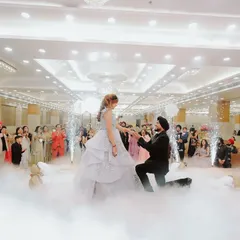 That picture perfect proposal moment, complete with smoke effects and the cheer of loved ones. I specialize in capturing the peak emotions of your engagement day, creating a memory you will cherish forever.
