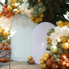 "Oh Baby!" This beautiful, modern baby shower setup with a balloon arch in earthy tones is a perfect example of how we tailor decor to your style.