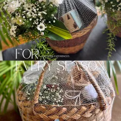 Curated experiences for every season. These baskets show my signature style of combining florals and gifts under a delicate net wrap for an elegant finish.