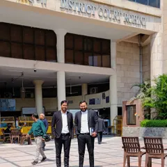 With a trusted colleague outside the Rohini District Court. We frequently handle criminal cases here and are familiar with the court's procedures.